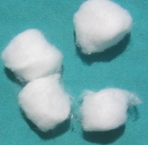 Cotton balls on blue background
