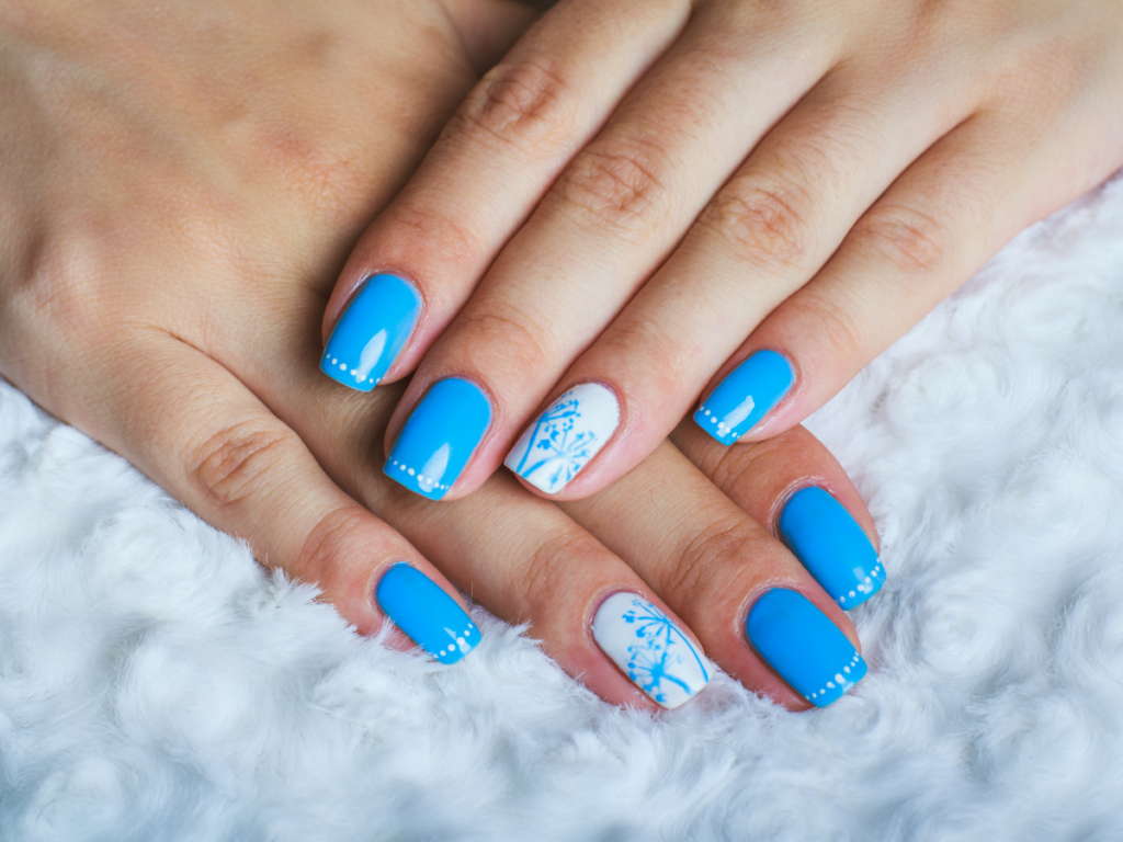 Blue nails with dandelion flower on white accent nail