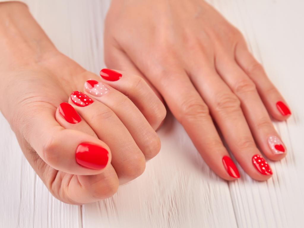 Classy modern red valentine's manicure with polka dots
